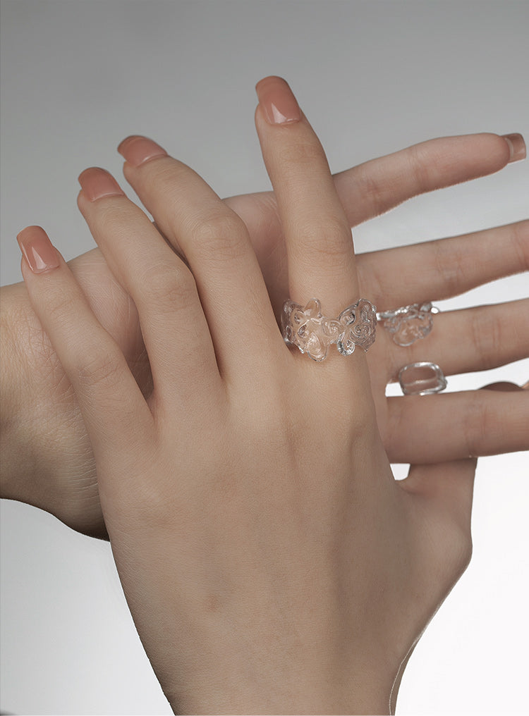 CARVED RESIN SWASTIKA-KNOT RING