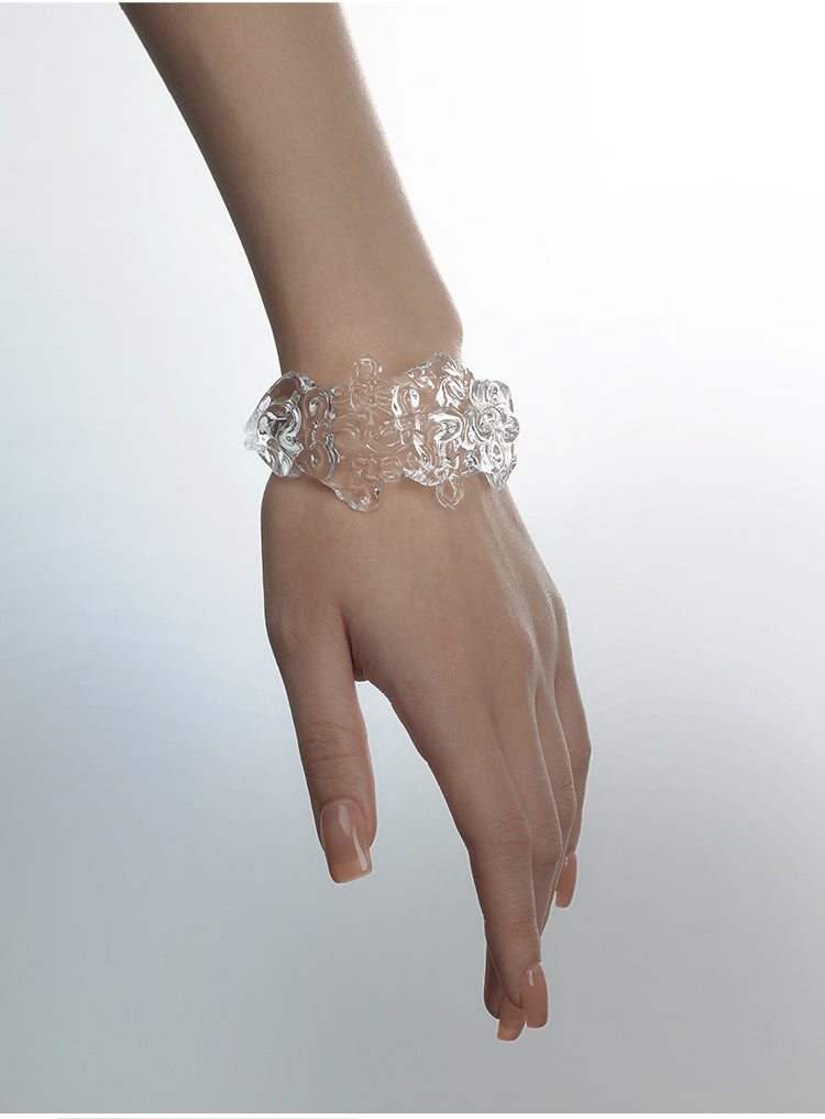 CARVED RESIN SWASTIKA-KNOT BANGLE