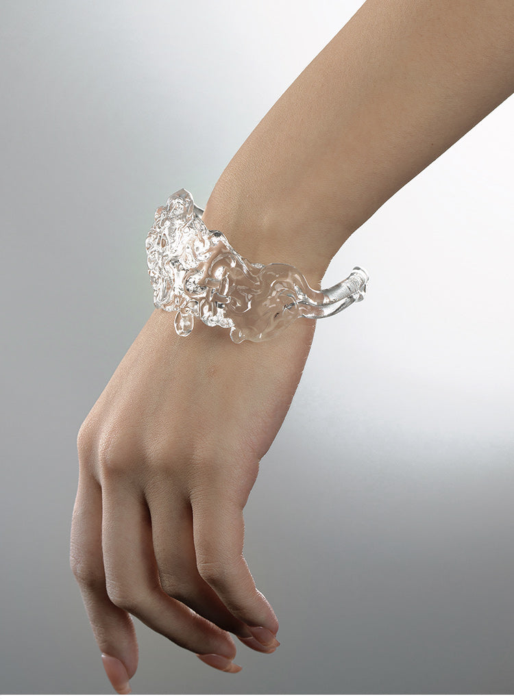 CARVED RESIN SWASTIKA-KNOT BANGLE