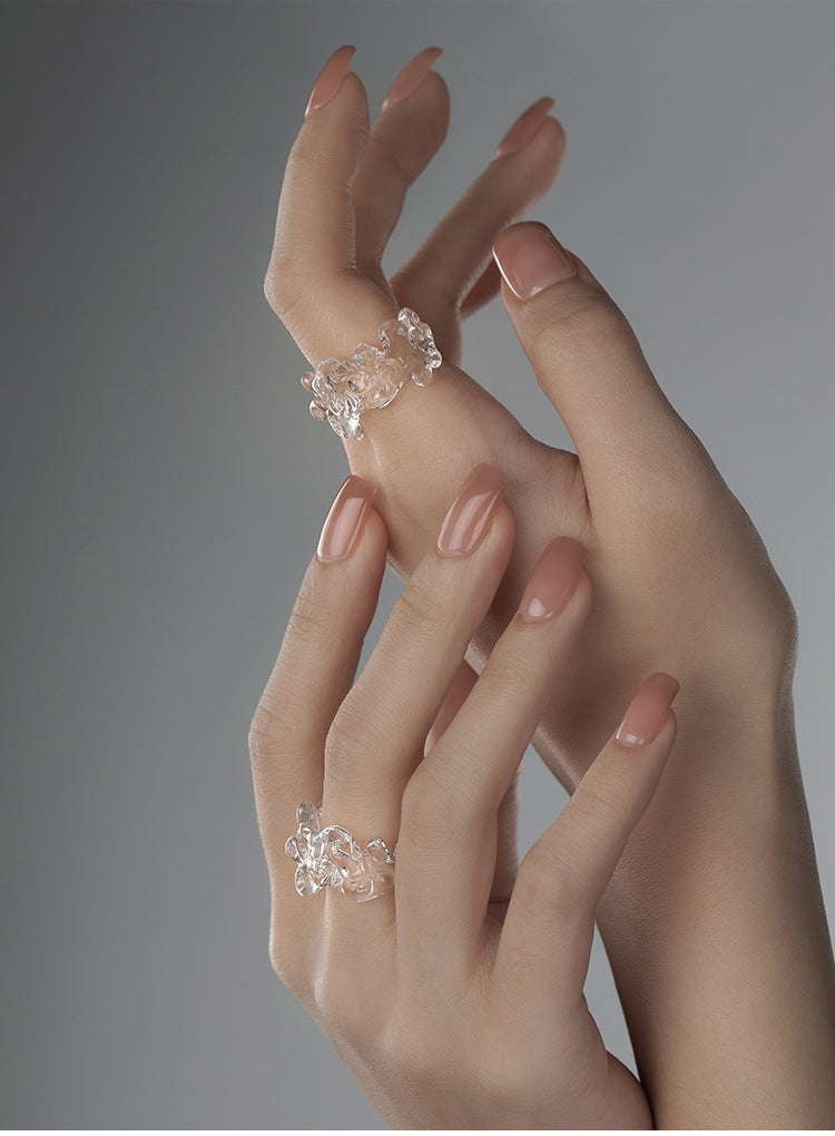 CARVED RESIN SWASTIKA-KNOT RING