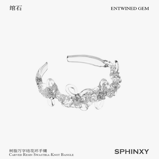 CARVED RESIN SWASTIKA-KNOT BANGLE